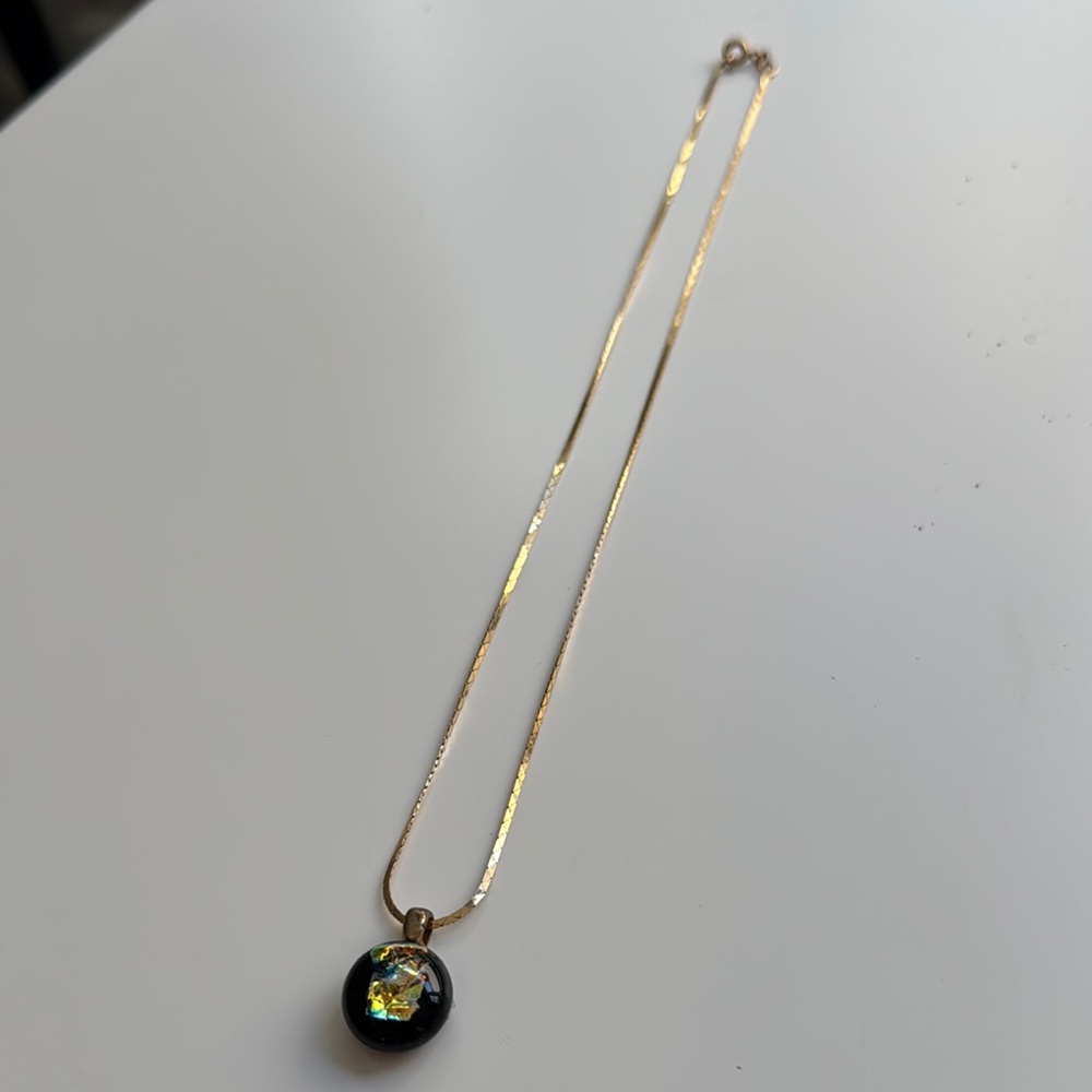 Elegant Gold Necklace with Black Pendant